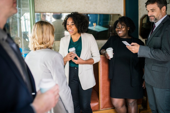 Picture of a happy workforce indicating high employee engagement